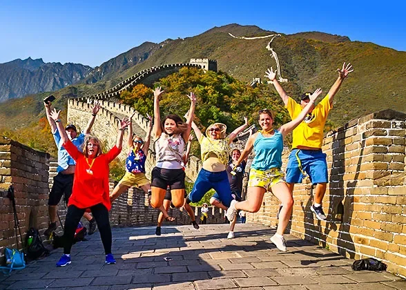 Travellers on the Great Wall with hills behind them